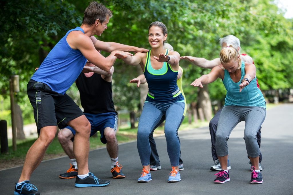 Group of friends exercising outdoors