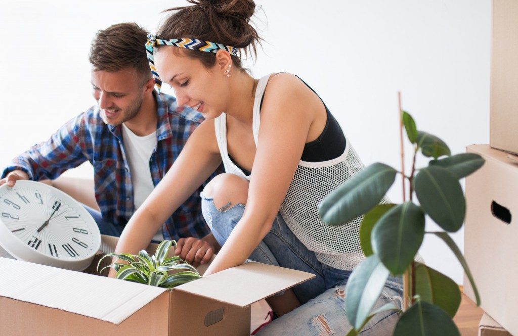 couple unpacking their things in their new apartment