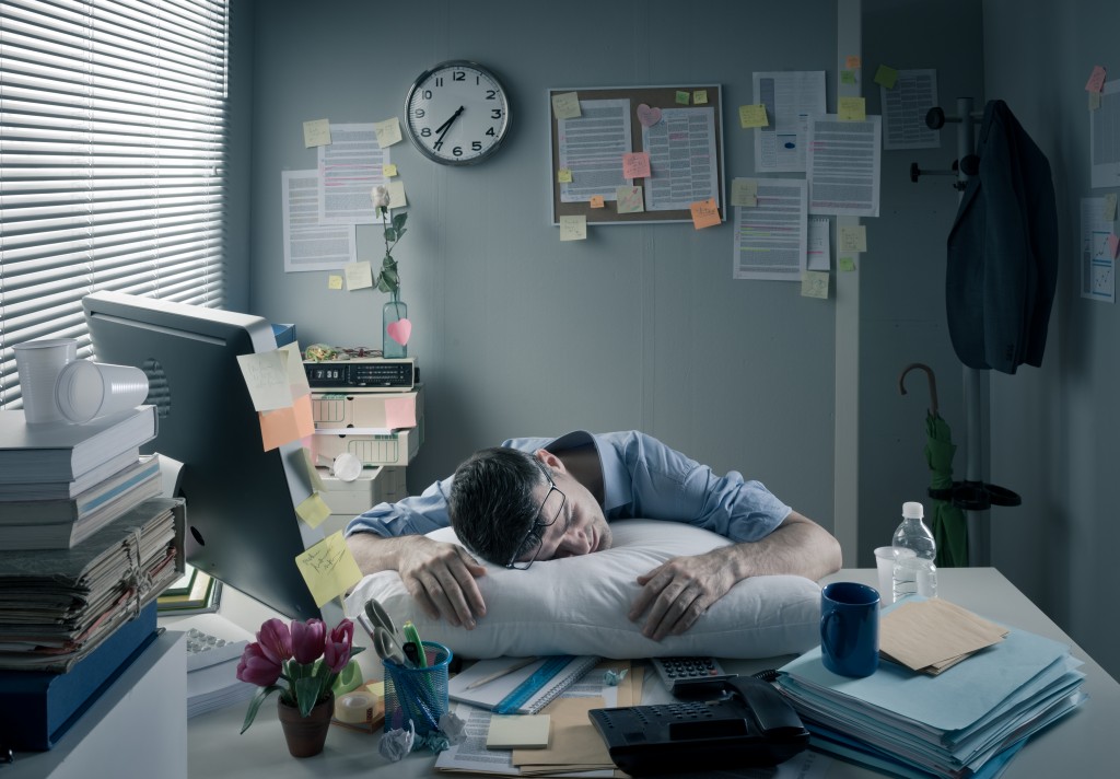 man feeling overworked