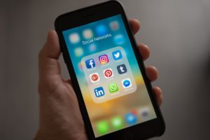 social media platform icons on a phone