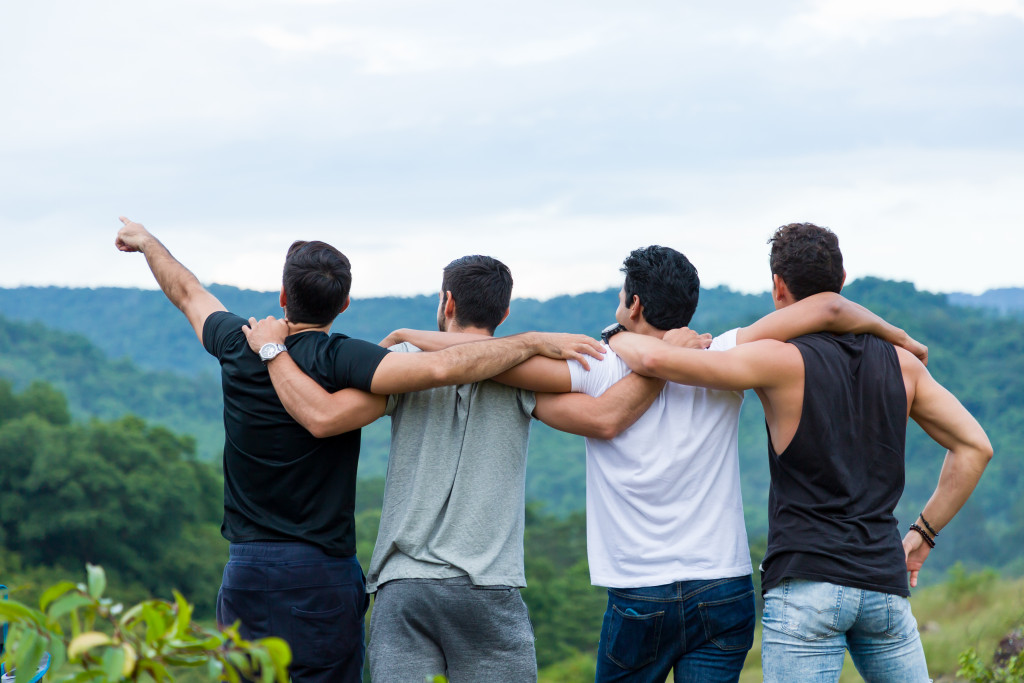 a group of male friends in the mountain